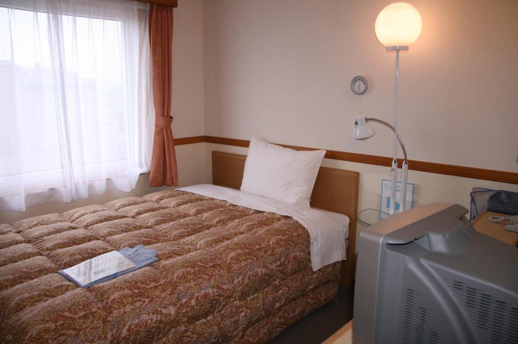 Toyoko Inn Hirosaki Ekimae Номер фото
